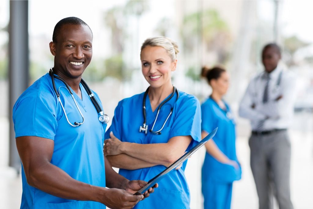 Nursing students smiling at the camera