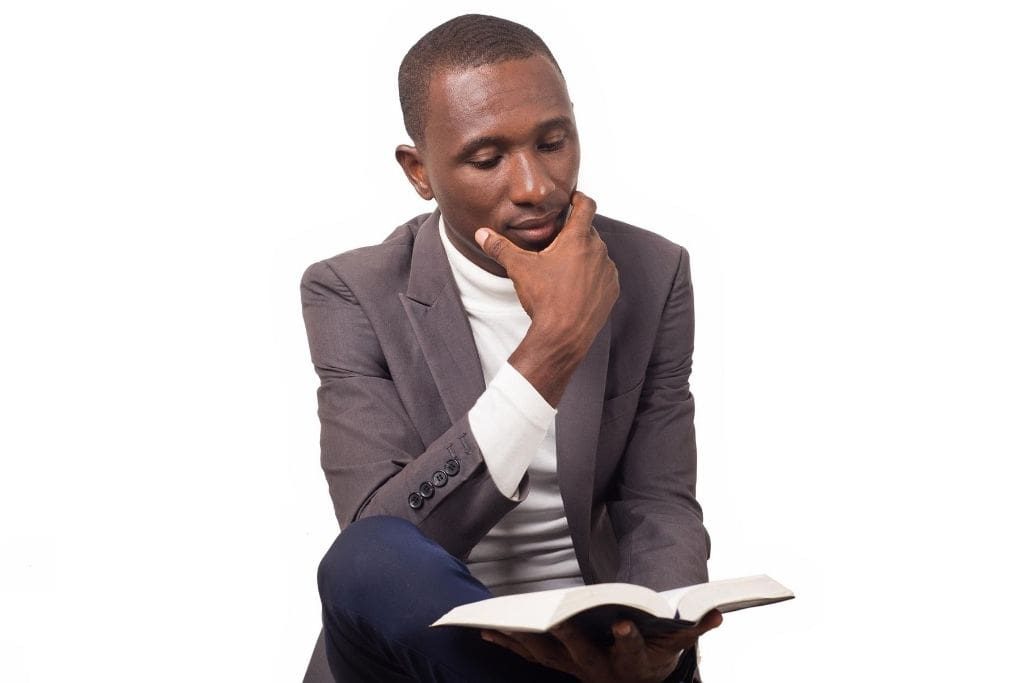 young teacher reads bible