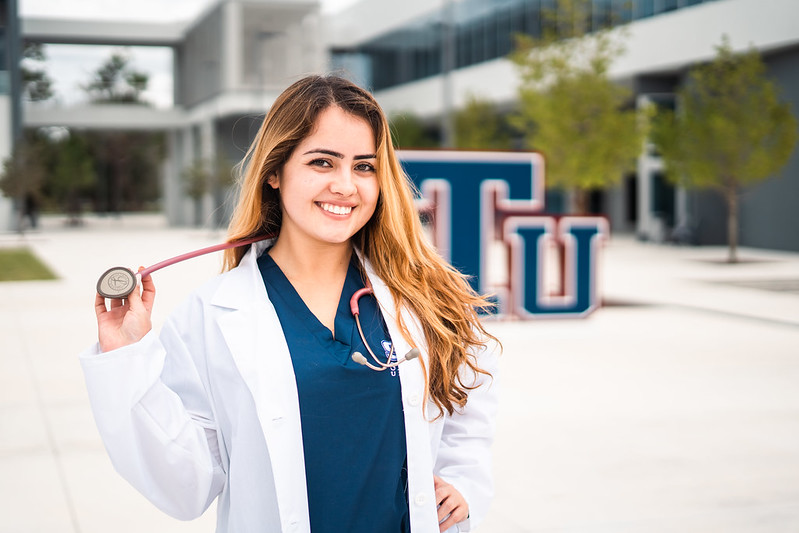 An STU Nursing student smiling outside