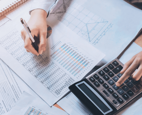 Businessperson doing calculations at work