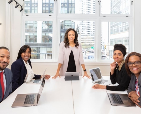 A group of professionals sit around a conference table
