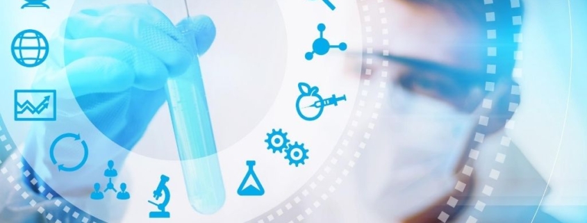 A male bioethicist holds a test tube in a lab