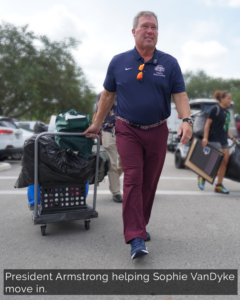 President Armstrong helping Sophie Van Dyke move in.
