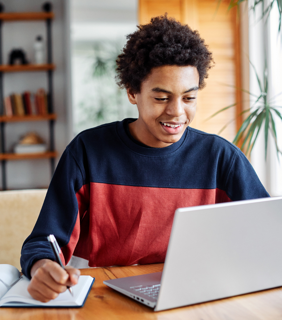 Student studying on laptop.