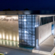 Night photo of the Gus Machado College of Business