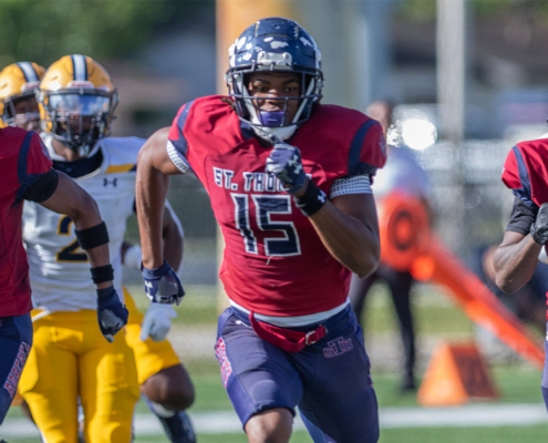 STU Bobcats football players in game.