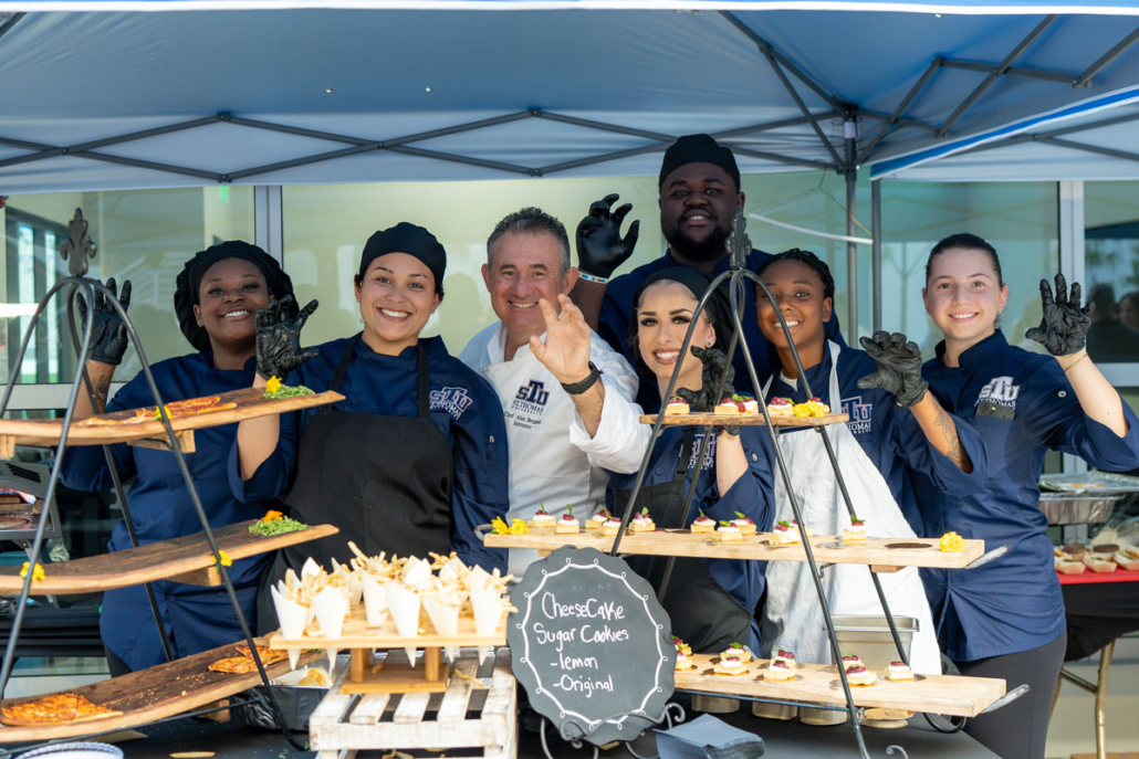Chefs waving to the camera