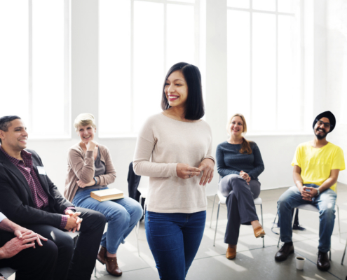 Female leader speaking to a room