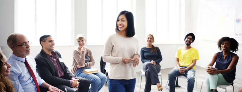 Female leader speaking to a room