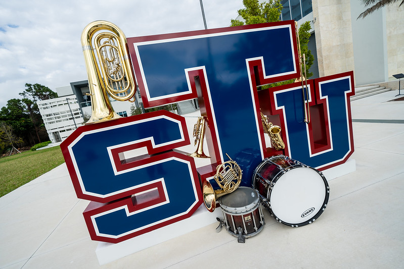 The STU Logo and musical instruments
